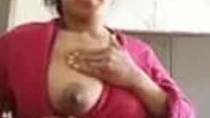 Indian Milf showing her boobs and undressing